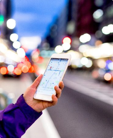 Apple Maps seen on Phone held in hand