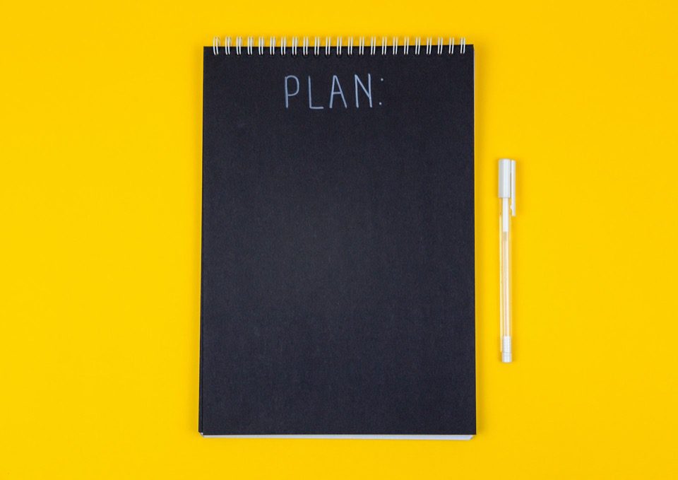 Image of a plan written on a black page with a white pen