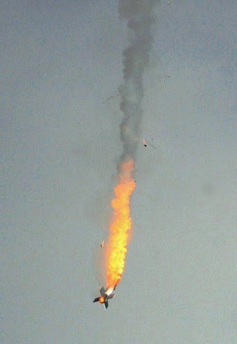 The top half of this rocket blew off as it was accelerating, a sure sign of a motor failure. Then it returned like a meteor to Earth. I kept the motor drive going on full telephoto to capture the sequence. Here are a sequence of four frames to ...