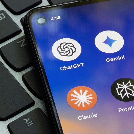 Smartphone screen displaying AI apps including ChatGPT, Gemini, Claude, and Perplexity