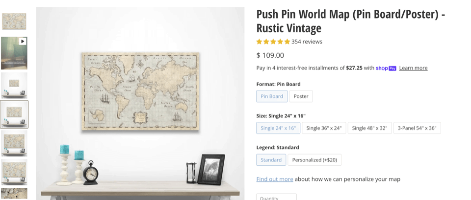 A world map hanging above a desk