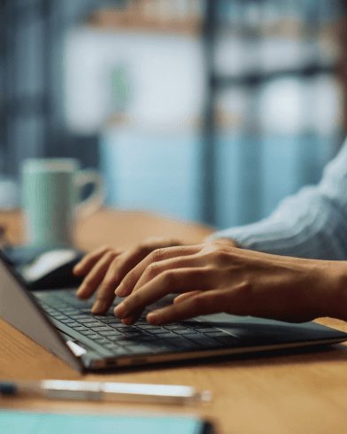 person typing on laptop