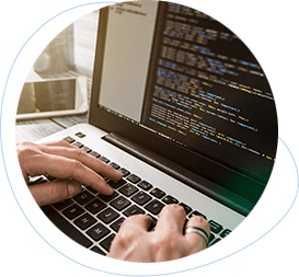 Developer typing code on a laptop during the development phase of a project