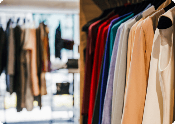 Clothing rack with colorful fashion apparel in a boutique retail setting