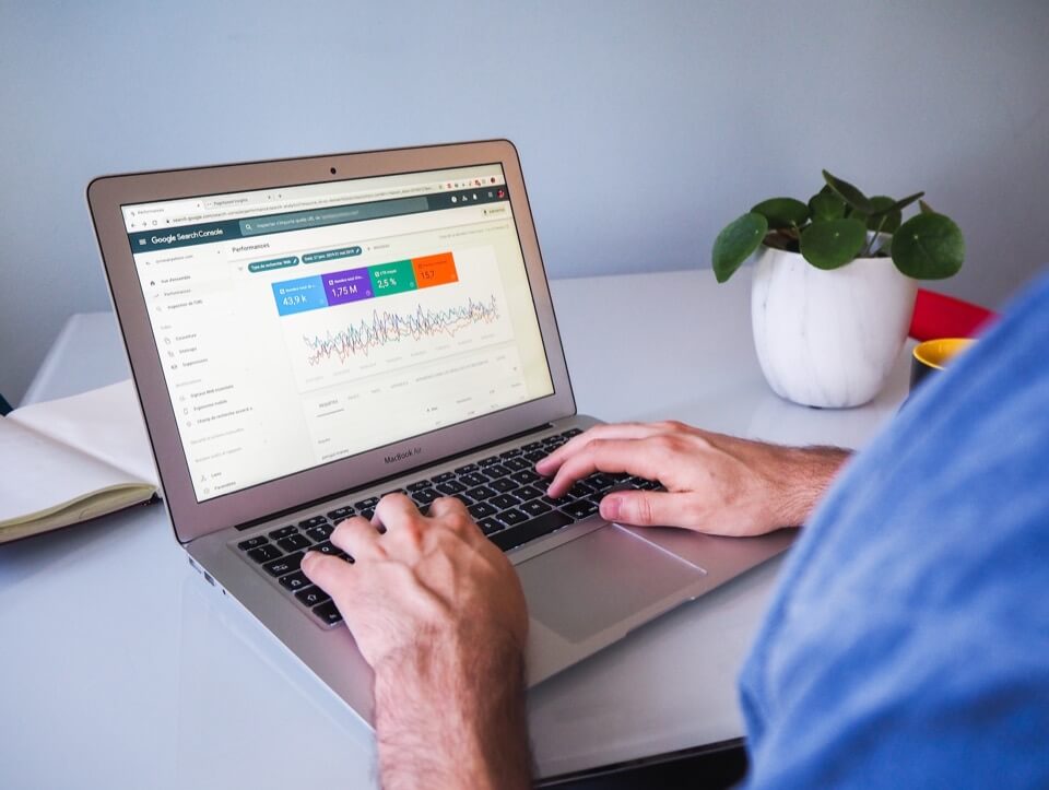Man in front of a laptop displaying the google search console