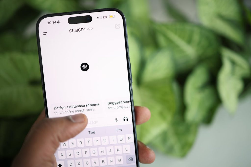 Hand holding a smartphone displaying ChatGPT search screen