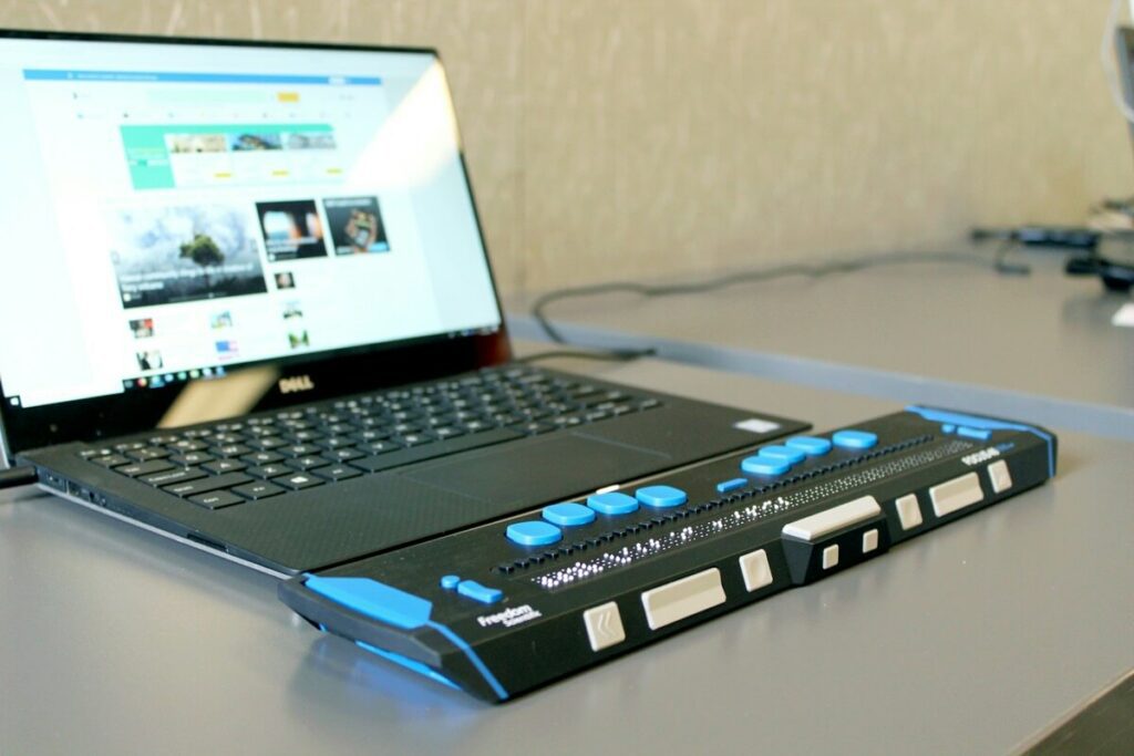 a laptop with a Braille keyboard