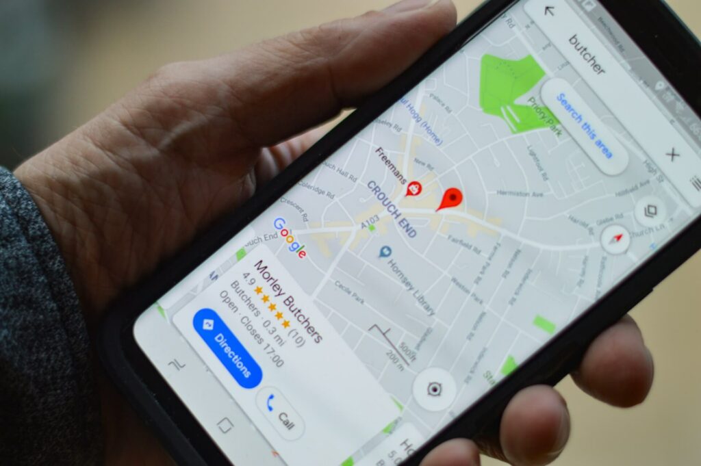 a phone showing a local business on a map