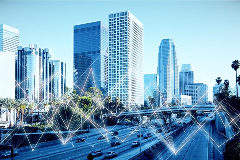 A bright view of Los Angeles buildings and roadways with superimposed zig-zags