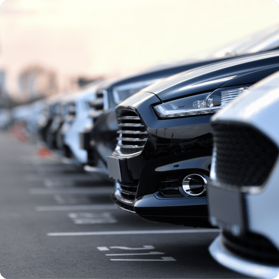 Row of vehicles parked at a car rental lot.