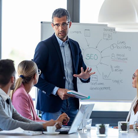 man presenting SEO concepts in front of a group