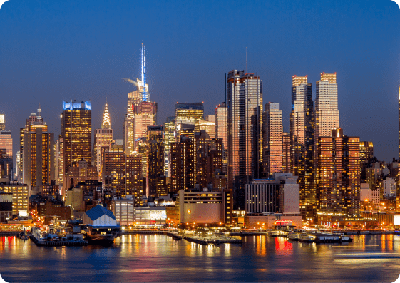 New York City skyline with Manhattan buildings at sunset.