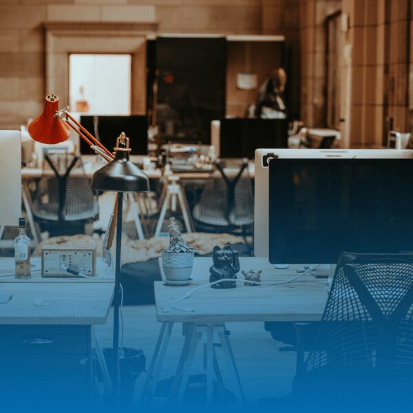 an empty office space with wooden desks