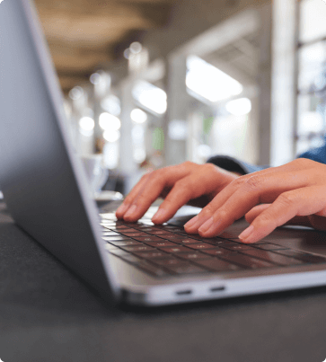 person typing on laptop