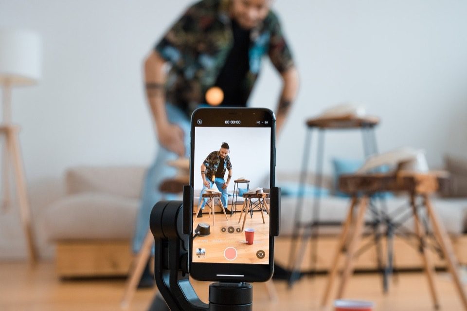 Person Shooting Video Using a Phone on a Tripod