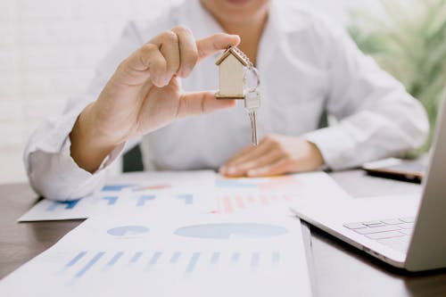 Real estate agent holding house key