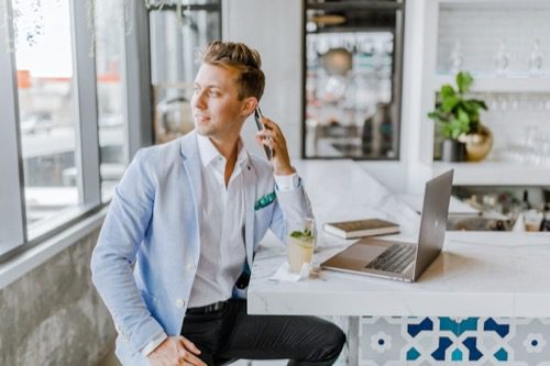 Real estate agent talking on phone
