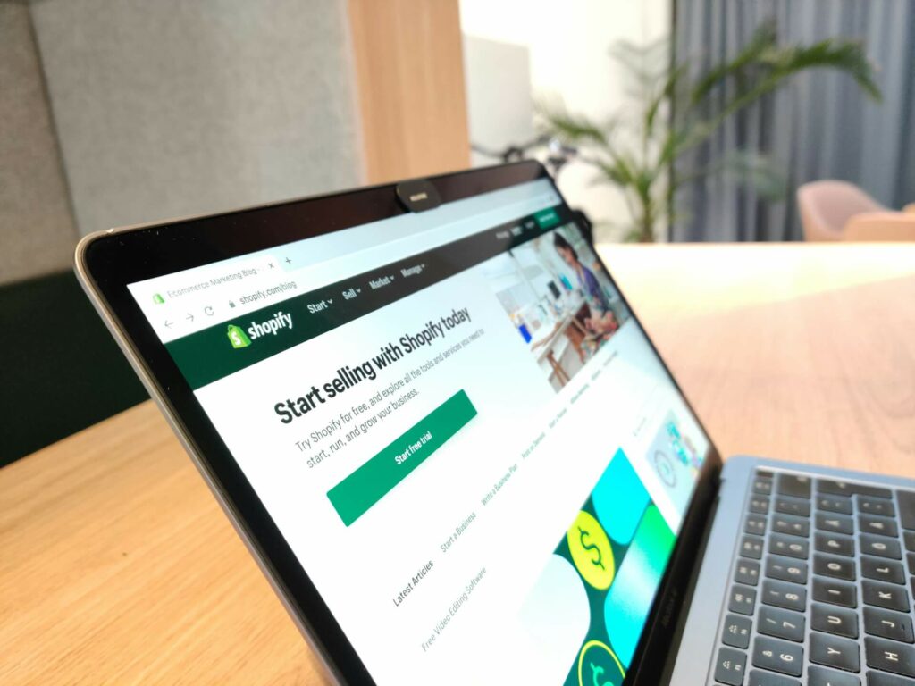 Shopify business landing page displayed on a laptop