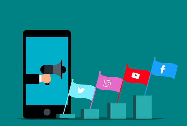 mobile phone and flags with social media icons