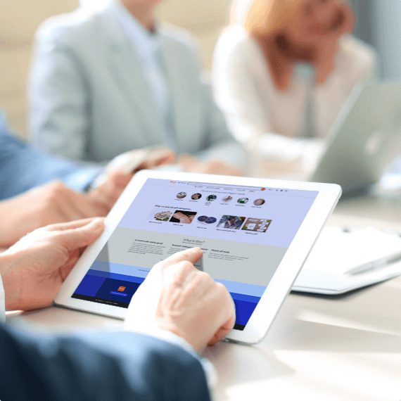 person holding a tablet showing an Etsy page