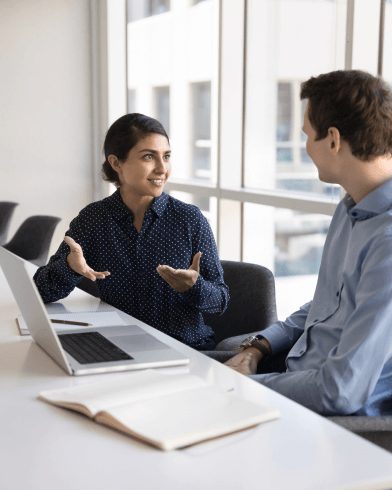 woman and man discussing solution providers