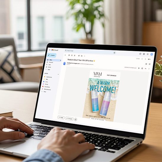 Laptop on desk displaying Gmail with welcome email marketing featuring skincare products
